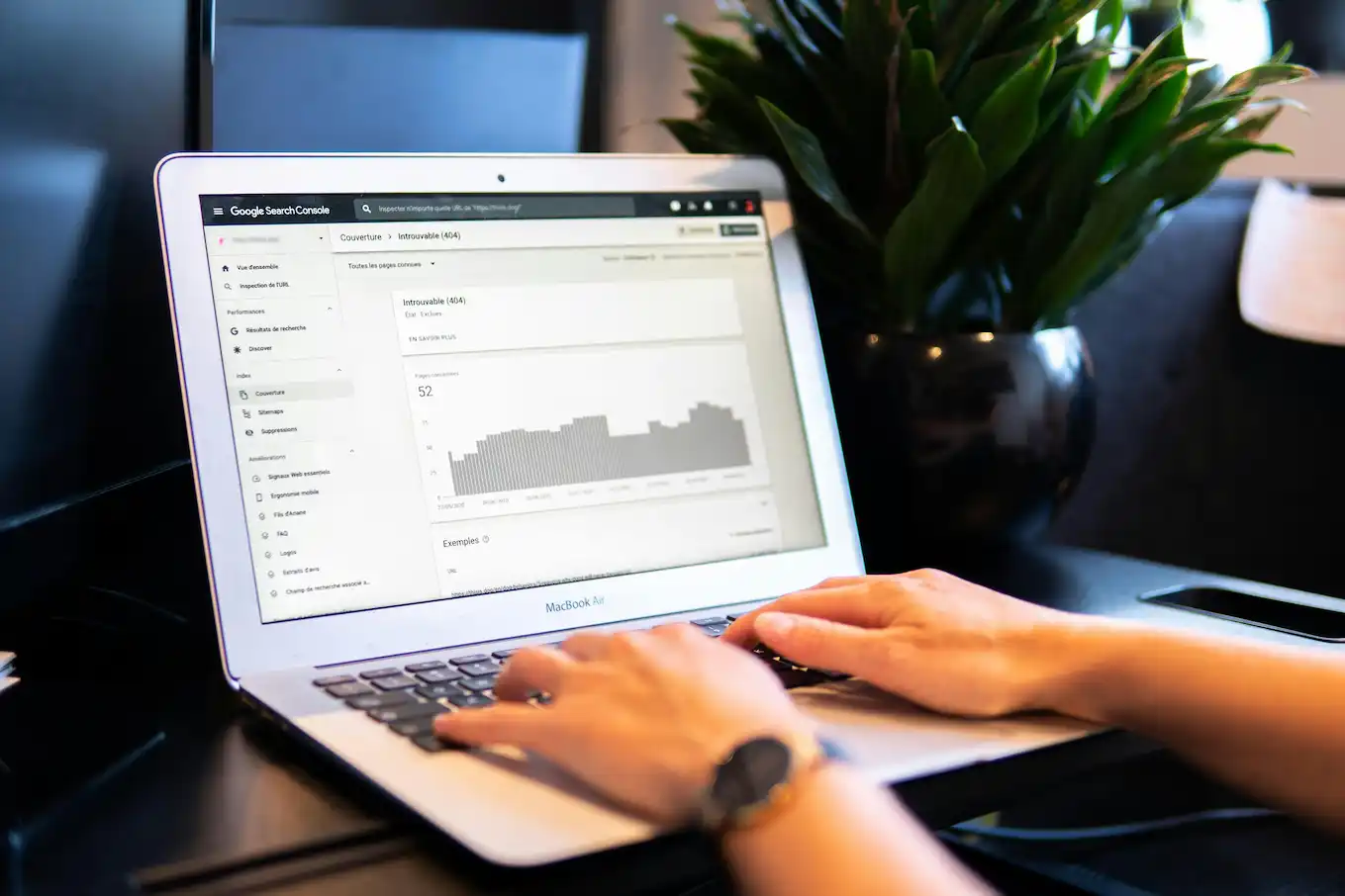 Creating SEO meta descriptions using a laptop